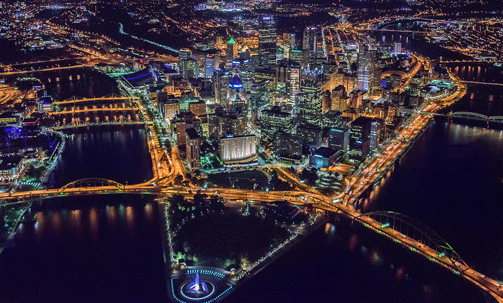 Pittsburgh glows at night in this aerial from over the Point. | Photo by Dave DiCello